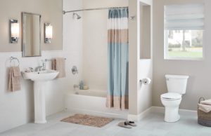Small bathrooms can be big on luxury and comfort, with the American Standard bright white Americast tub accented with a high-style Colony PRO shower/tub faucet set and matching bathroom sink faucet, all for an affordable price.